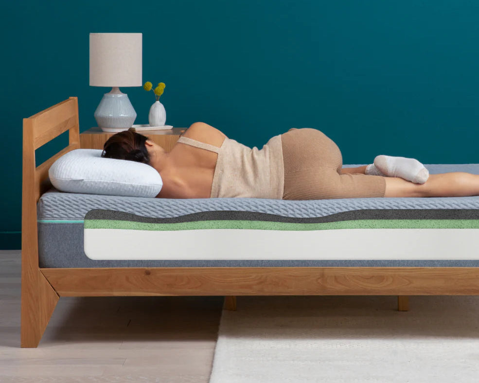 Woman sleeping on her side on an adaptive foam mattress 
