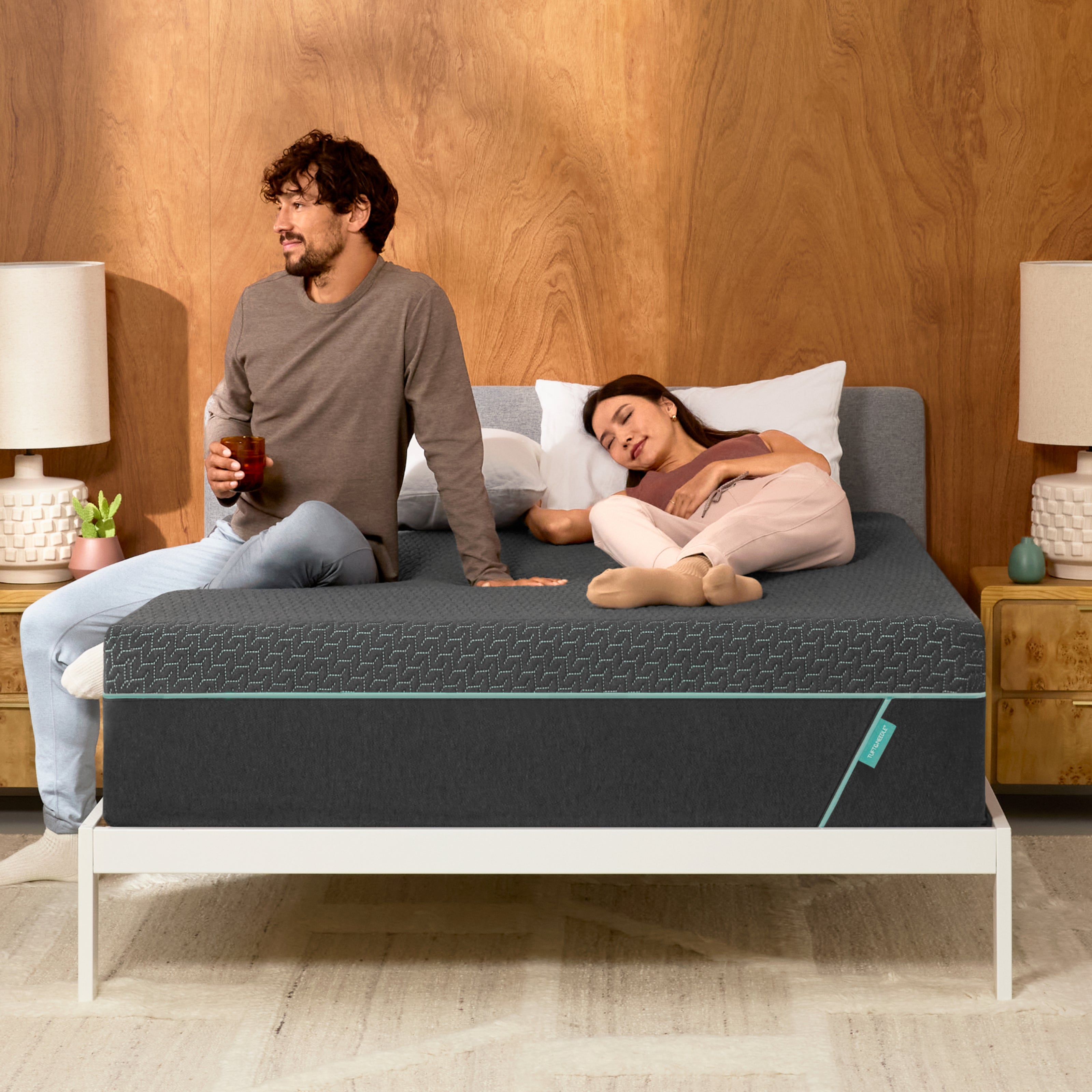 Couple lounges on mint hybrid mattress 