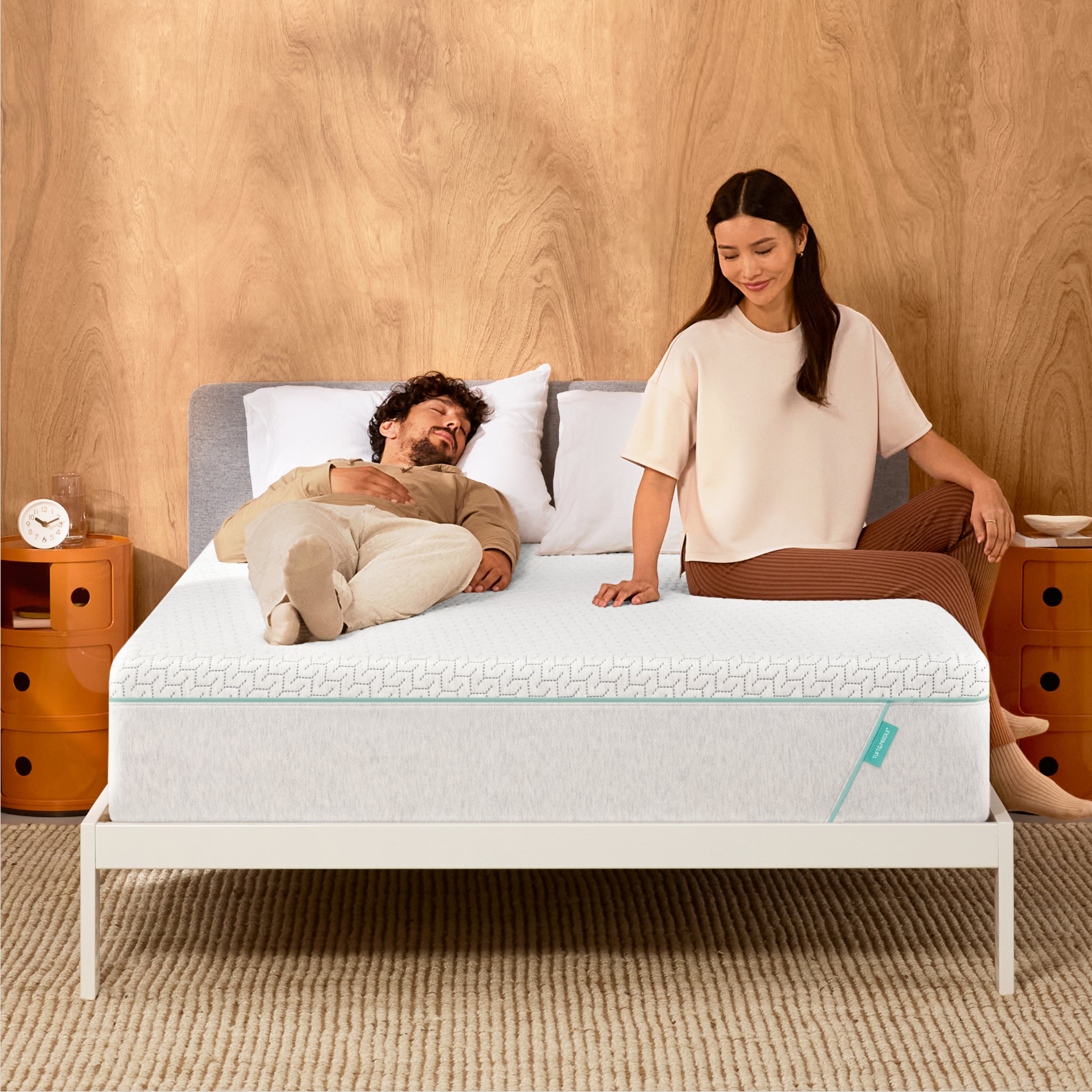 Couple lounges on mint hybrid mattress 
