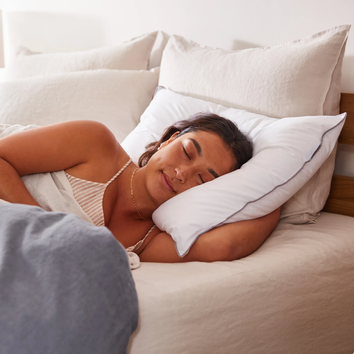 Woman laying in T&N bedding