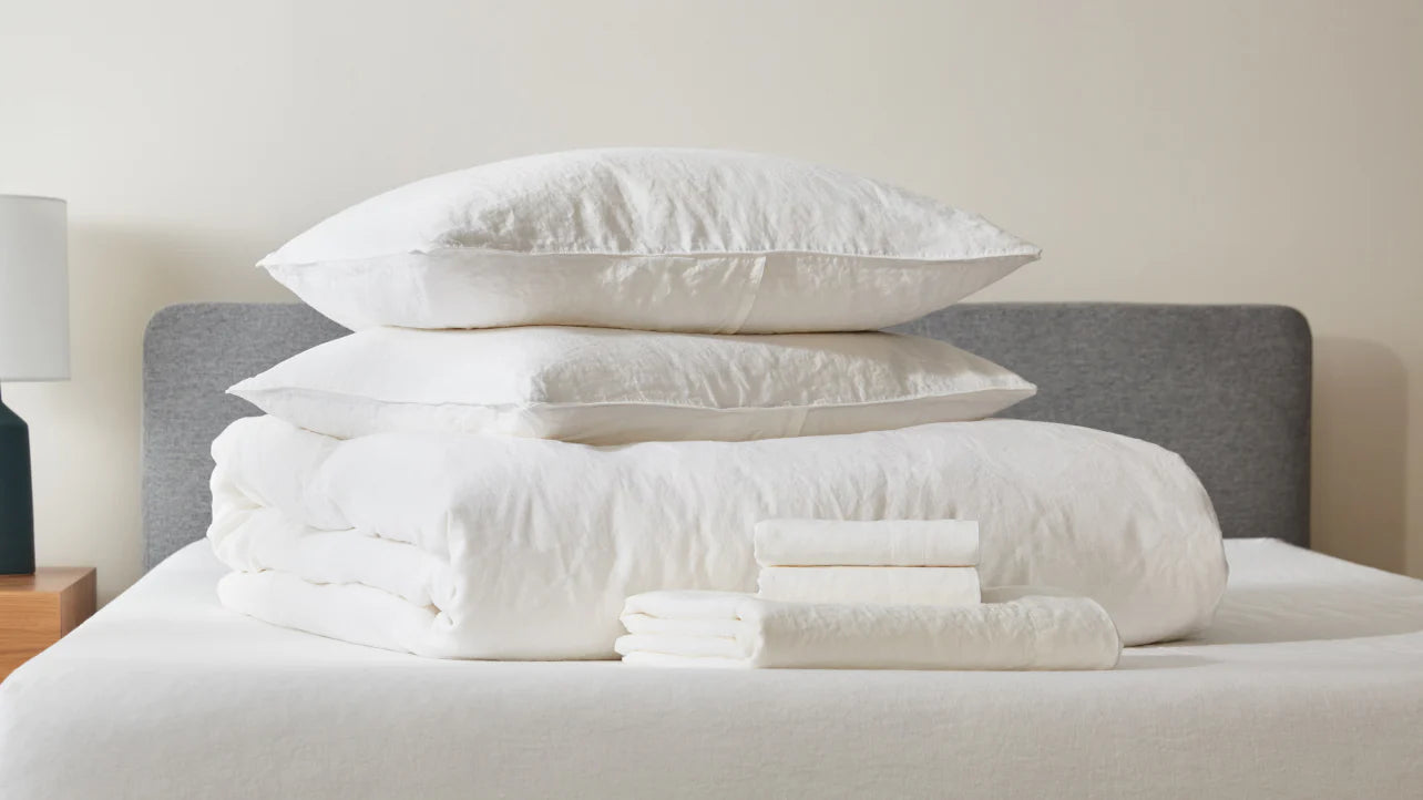 Duvet, sheet, and pillow set on top of bed